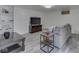 Basement entertainment area with sleek furniture and hardwood-style flooring at 1504 Mcclure Rd, Columbus, IN 47201