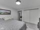 Comfortable bedroom with double closets and an accent painting at 1504 Mcclure Rd, Columbus, IN 47201