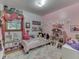 Pink bedroom with dolls and stuffed animals at 1504 Mcclure Rd, Columbus, IN 47201