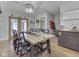 Bright dining room with a large wooden table and seating for eight at 1504 Mcclure Rd, Columbus, IN 47201