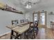 Dining room featuring a rustic table, modern lighting, and ample seating at 1504 Mcclure Rd, Columbus, IN 47201