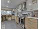 Bright kitchen featuring modern appliances, quartz countertops, and subway tile backsplash at 1504 Mcclure Rd, Columbus, IN 47201