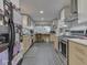 Stylish kitchen features modern appliances, bright cabinets, and subway tile, combining functionality with a clean, modern aesthetic at 1504 Mcclure Rd, Columbus, IN 47201