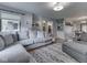Comfortable living room with open sight lines and a large gray sectional couch at 1504 Mcclure Rd, Columbus, IN 47201
