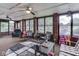 Open sunroom with exposed brick and view of the yard at 1504 Mcclure Rd, Columbus, IN 47201
