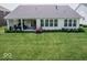 Back exterior featuring large patio, windows for natural light, and manicured backyard space at 15879 Viking Commander Way, Westfield, IN 46074