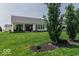 Lovely backyard with mature trees and covered patio, ideal for outdoor enjoyment and relaxation at 15879 Viking Commander Way, Westfield, IN 46074