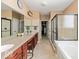 Spacious bathroom with dual sinks, a soaking tub, and a glass-enclosed shower at 15879 Viking Commander Way, Westfield, IN 46074