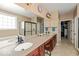 Bright bathroom boasts a dual vanity, separate shower, tub, and walk-in closet at 15879 Viking Commander Way, Westfield, IN 46074