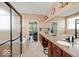Bright bathroom boasts a dual vanity, separate shower, and tub with modern fixtures at 15879 Viking Commander Way, Westfield, IN 46074