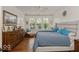 Comfortable bedroom features a plush bed, bright natural light, and a chest of drawers at 15879 Viking Commander Way, Westfield, IN 46074