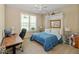 Cozy bedroom with built-in Murphy bed and a well-lit workspace, ideal for a home office at 15879 Viking Commander Way, Westfield, IN 46074