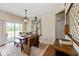 Cozy dining room with natural light, wooden table and bench seating, adjacent to outdoor access at 15879 Viking Commander Way, Westfield, IN 46074