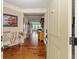 Inviting foyer with hardwood floors and a view into the living spaces at 15879 Viking Commander Way, Westfield, IN 46074