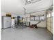 Spacious garage with ample storage cabinets, epoxy flooring, and high ceilings at 15879 Viking Commander Way, Westfield, IN 46074