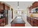 Open-concept kitchen with granite countertops and stainless steel appliances, perfect for entertaining at 15879 Viking Commander Way, Westfield, IN 46074