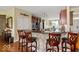 Kitchen with beautiful granite countertops, stainless steel appliances, and counter seating at 15879 Viking Commander Way, Westfield, IN 46074
