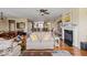 Spacious living room featuring hardwood floors, a fireplace, open floor plan, and ample seating at 15879 Viking Commander Way, Westfield, IN 46074