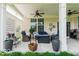 Relaxing covered patio with ceiling fans and comfortable seating at 15879 Viking Commander Way, Westfield, IN 46074