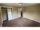 Bedroom with carpeted flooring, closet, and adjacent room entry at 1749 N Graham Ave, Indianapolis, IN 46218