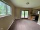 Bright dining area featuring a large window and sliding door that leads to the patio at 1749 N Graham Ave, Indianapolis, IN 46218