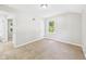 Bedroom with neutral carpet, white walls, and natural light from a window at 220 Central Ave, Anderson, IN 46012