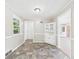 Cozy dining room featuring a built-in cabinet and vinyl flooring at 220 Central Ave, Anderson, IN 46012