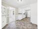 Bright kitchen boasts white cabinets and stainless-steel appliances at 220 Central Ave, Anderson, IN 46012
