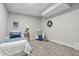 Comfortable bedroom featuring neutral gray walls and plush carpet, with a cozy lounge area at 2896 Sutherland Ave, Indianapolis, IN 46205