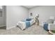 Cozy bedroom featuring neutral gray walls and plush carpet, with a comfortable lounge area at 2896 Sutherland Ave, Indianapolis, IN 46205