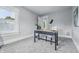 Bright, airy bedroom office space featuring gray walls and carpet, with a view of the outside at 2896 Sutherland Ave, Indianapolis, IN 46205