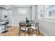 Open dining area features wood floors and an adjacent kitchen view at 2896 Sutherland Ave, Indianapolis, IN 46205