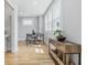 Bright dining area features hardwood floors, large windows, and a modern table setting at 2896 Sutherland Ave, Indianapolis, IN 46205