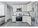 Modern kitchen features stainless steel appliances and light wood cabinets at 2896 Sutherland Ave, Indianapolis, IN 46205