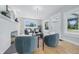 Well-lit living room with hardwood floors, comfortable seating, and an elegant fireplace at 2896 Sutherland Ave, Indianapolis, IN 46205