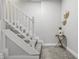 Clean stairway with white wooden banister and plush carpet, leading to the next floor at 2896 Sutherland Ave, Indianapolis, IN 46205