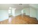 Spacious attic bedroom featuring hardwood floors and natural light from a window at 2908 Sherman St, Anderson, IN 46016