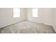 Neutral bedroom featuring newer carpet, two windows letting in natural light at 2908 Sherman St, Anderson, IN 46016