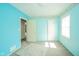 Bright bedroom featuring blue walls, neutral carpet, and charming wallpaper border at 2908 Sherman St, Anderson, IN 46016