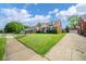 Lovely brick home featuring a tidy lawn, a driveway, and an inviting curb appeal at 2908 Sherman St, Anderson, IN 46016