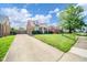 Beautiful brick home featuring a spacious driveway and a well-maintained lawn at 2908 Sherman St, Anderson, IN 46016