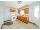 Kitchen features linoleum flooring, oak cabinets, and white appliances at 2908 Sherman St, Anderson, IN 46016