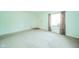 Cozy living room with soft carpet, a window, and neutral colored walls at 2908 Sherman St, Anderson, IN 46016