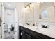 Bathroom featuring a double vanity with framed mirrors and a toilet in a separate room at 2928 Mounds Rd, Anderson, IN 46016