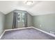 Small bedroom with neutral carpet and a large window that offers natural light at 2928 Mounds Rd, Anderson, IN 46016