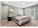 Cozy bedroom with soft carpet, gray walls, and french doors leading outside at 2928 Mounds Rd, Anderson, IN 46016
