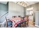 Traditional dining room featuring a large table, chandelier lighting, and classic decor at 2928 Mounds Rd, Anderson, IN 46016