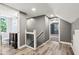 Upstairs hallway with views into the bathroom and bedroom at 2928 Mounds Rd, Anderson, IN 46016