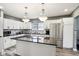 Modern kitchen featuring white cabinetry, granite countertops, stainless steel appliances, and a center island at 2928 Mounds Rd, Anderson, IN 46016