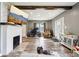 Inviting living room featuring a fireplace, wood floors, and neutral paint tones at 2928 Mounds Rd, Anderson, IN 46016
